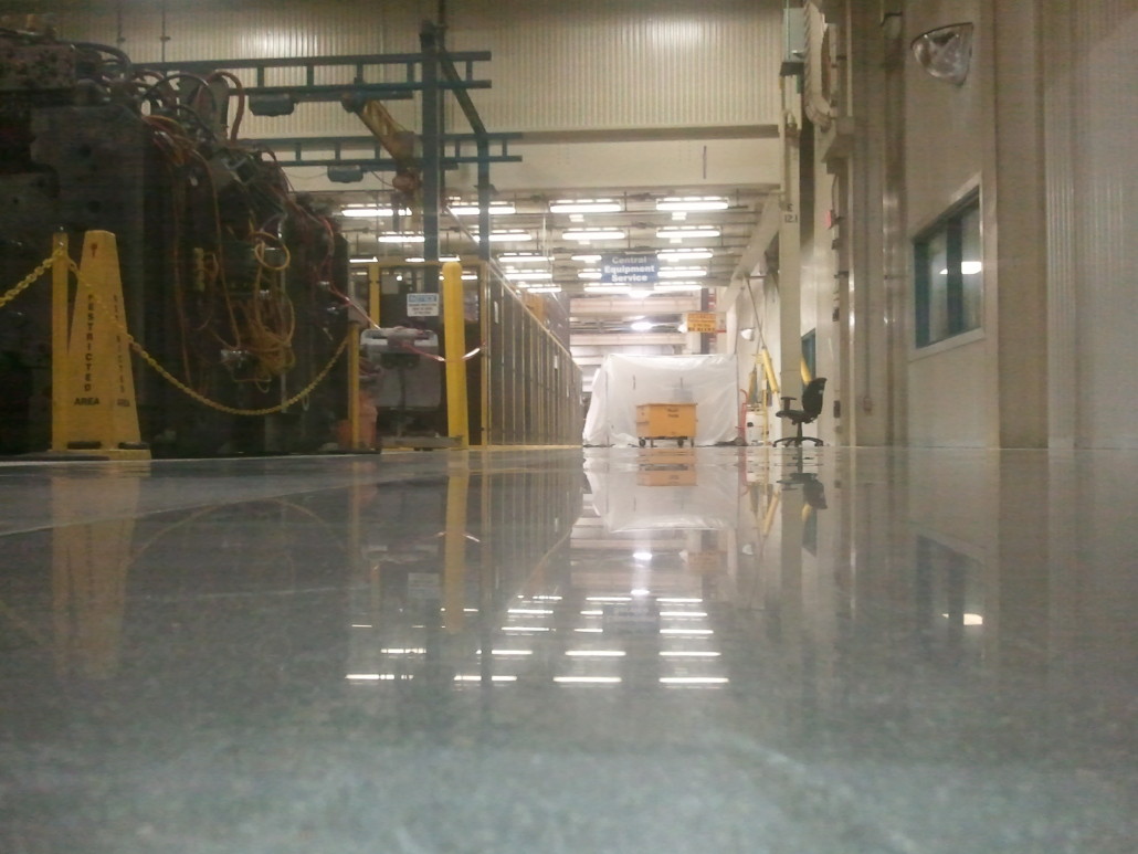 Floor polishing at automotive manufacturing company. PolishMaxx polished concrete contractor