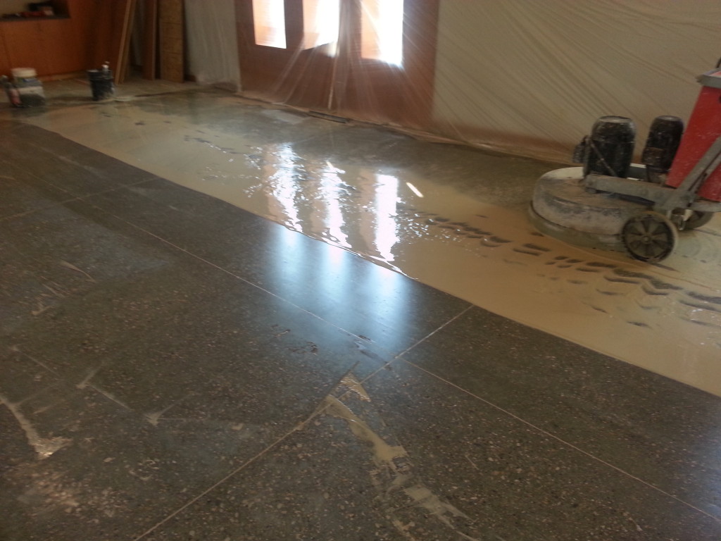 In progress wet grinding concrete floor PolishMaxx polished concrete contractor in Iowa/Illinois
